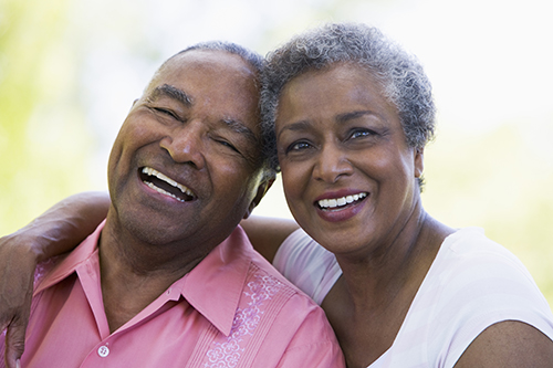 Elderly african american couple laughing and smiling together
